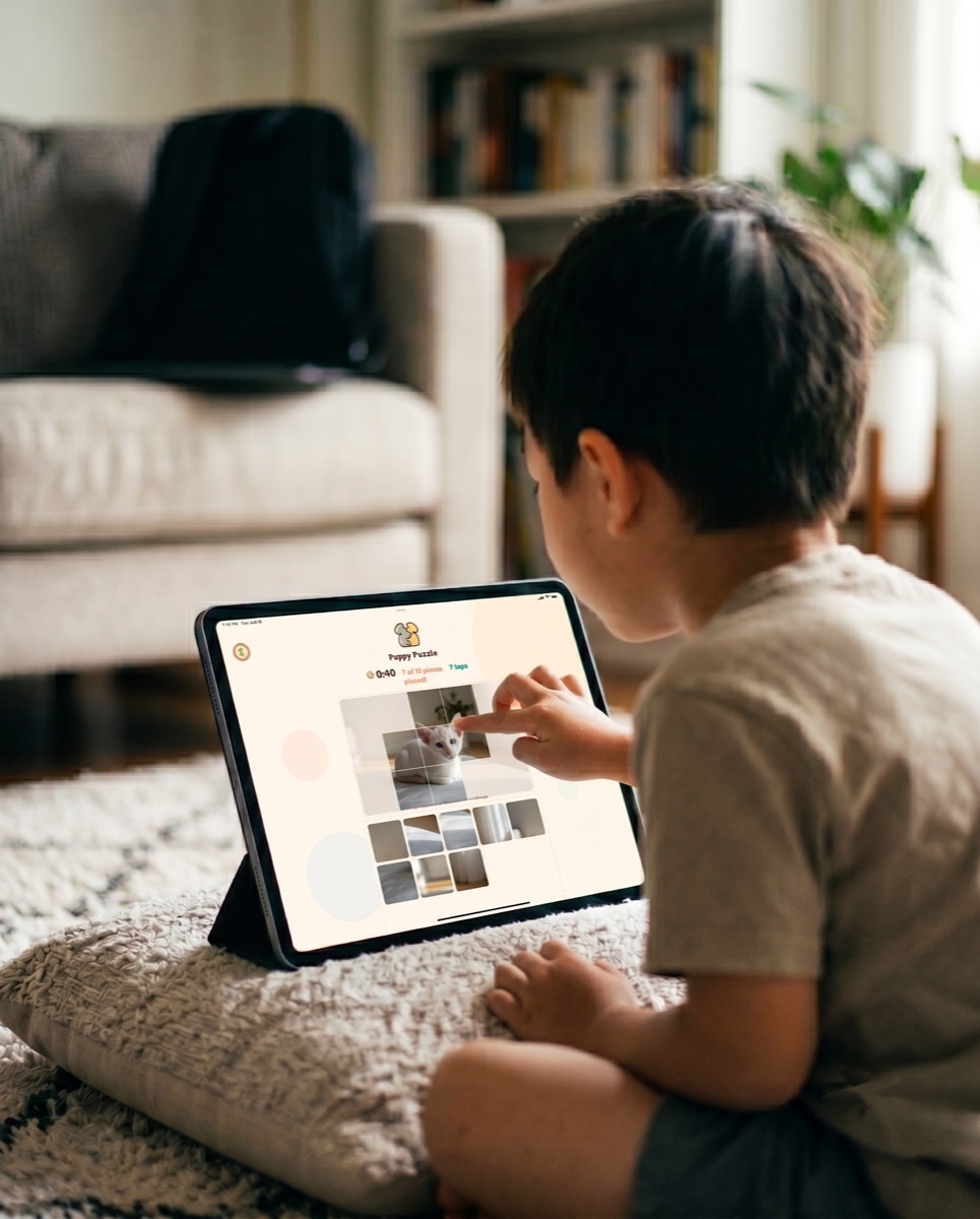 A child playing a Wild Atlas matching game at home